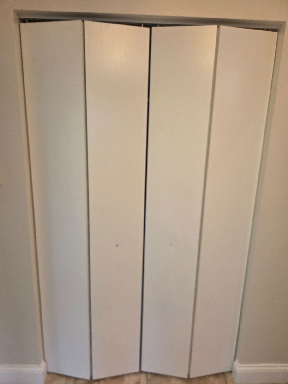 Bi-fold doors and trim with a smooth, even white finish